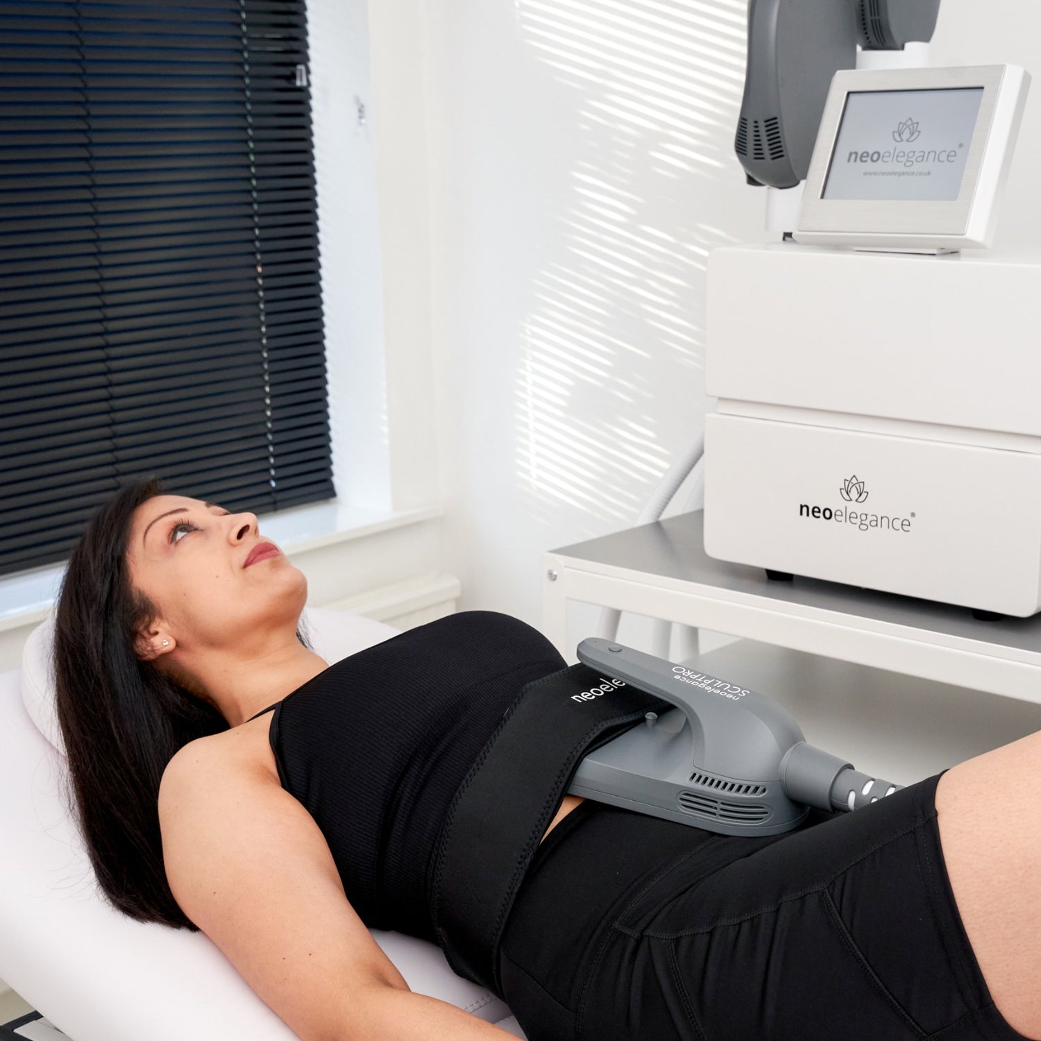 Neo Body SculptPro From Neo Elegance in use for Tummy Tightening in a clinic